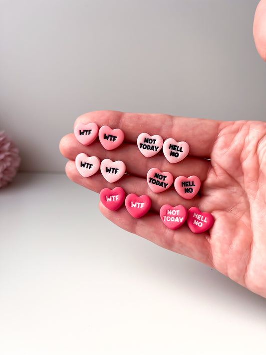 rude loveheart studs